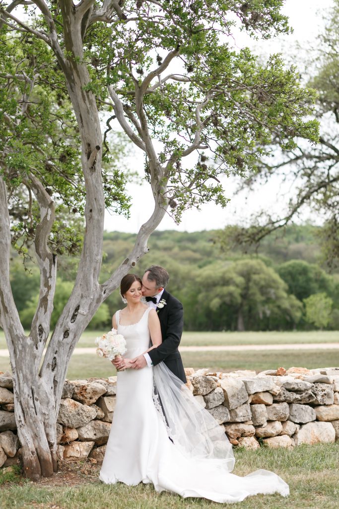 bride and groom hugging