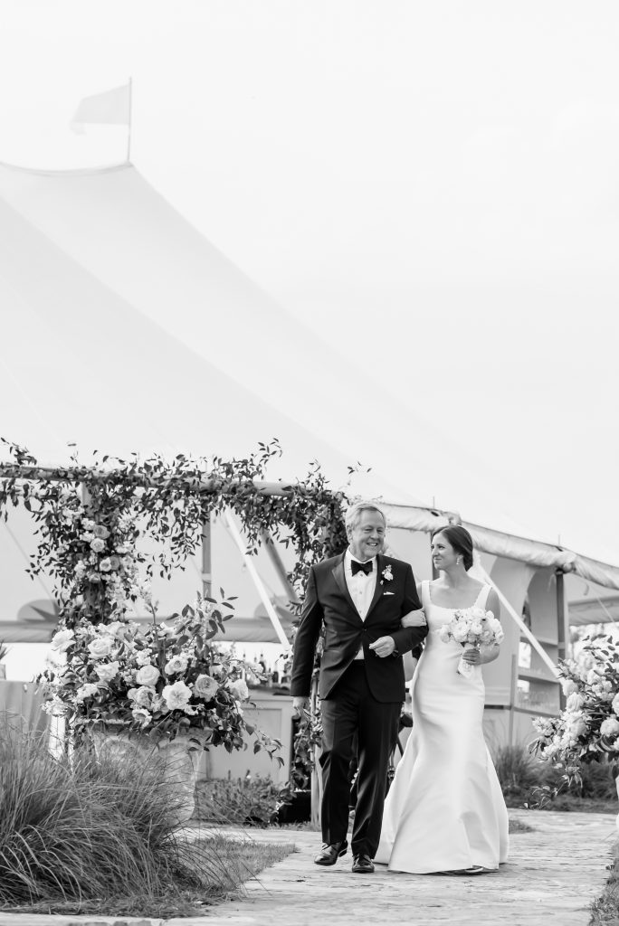 father of the bride walking the bride down the aisle