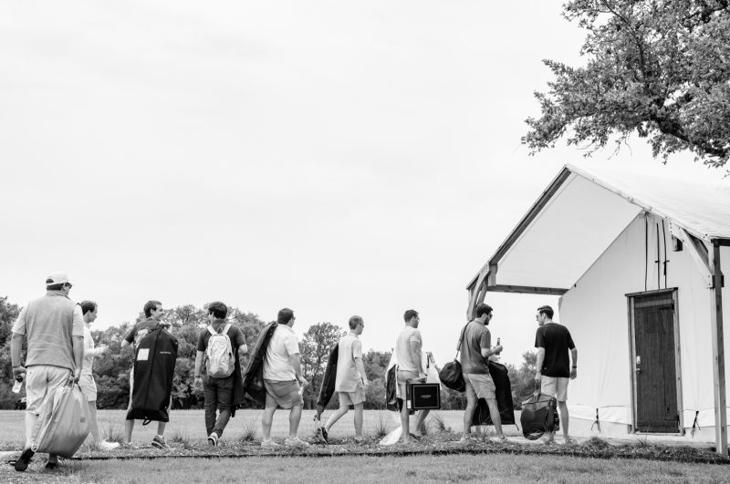 groomsmens walking in to get ready