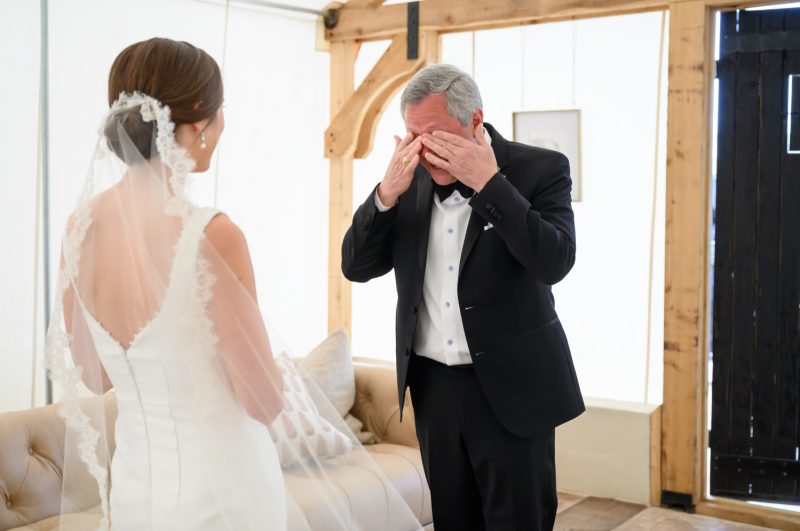 father of the bride seeing the bride in her wedding dress