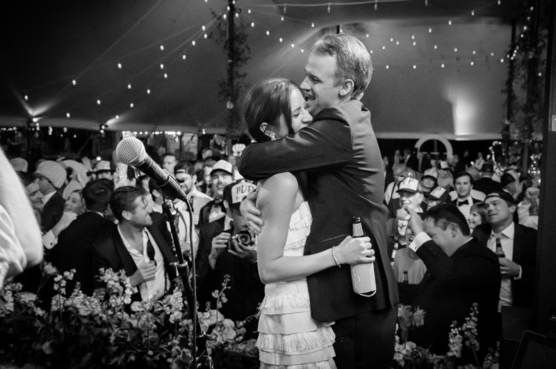 bride and groom dancing on stage