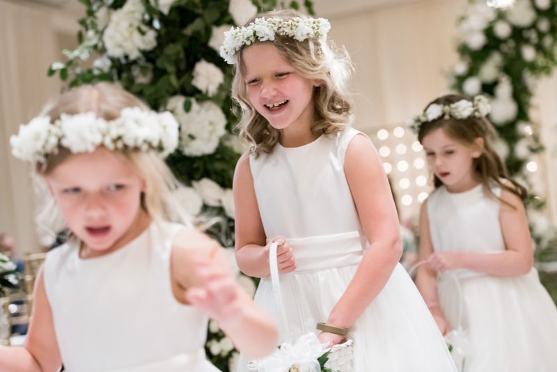 flower girls walking down the aisle