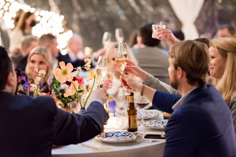 guests toasting champagne at rehearsal dinner