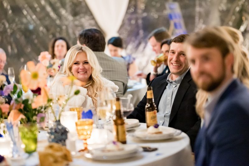 bride and groom laughing at the rehearsal dinner