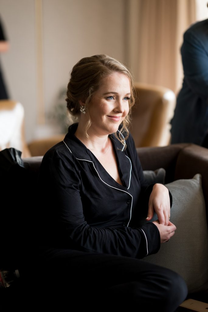 bridesmaid watching the bride get ready