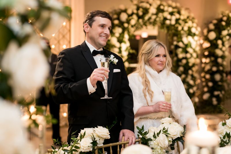bride and groom holding champagne flutes