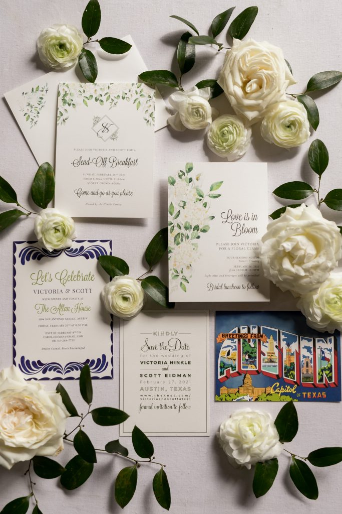 white and green wedding stationary with white florals