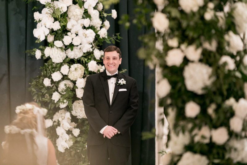 groom seeing his bride walk down the aisle