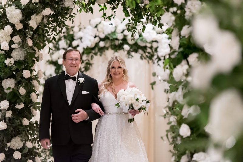 father of the bride walking bride down the aisle