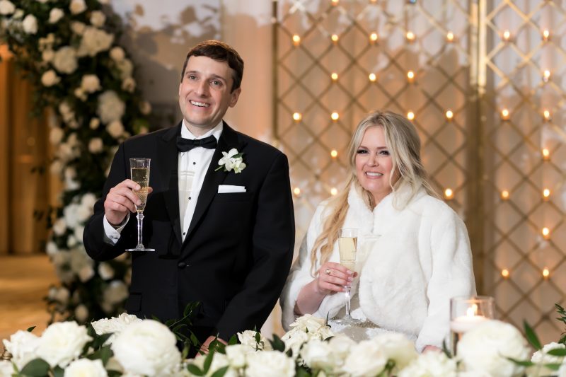 bride and groom holding champagne flutes