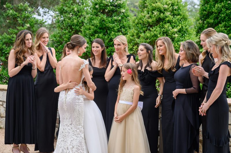 bride showing her bridesmaids her dress