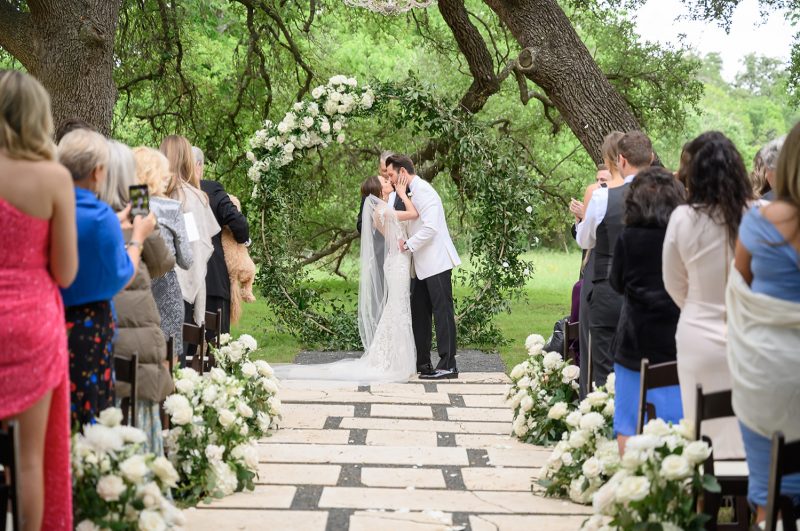 bride and groom kissing during the ceremony