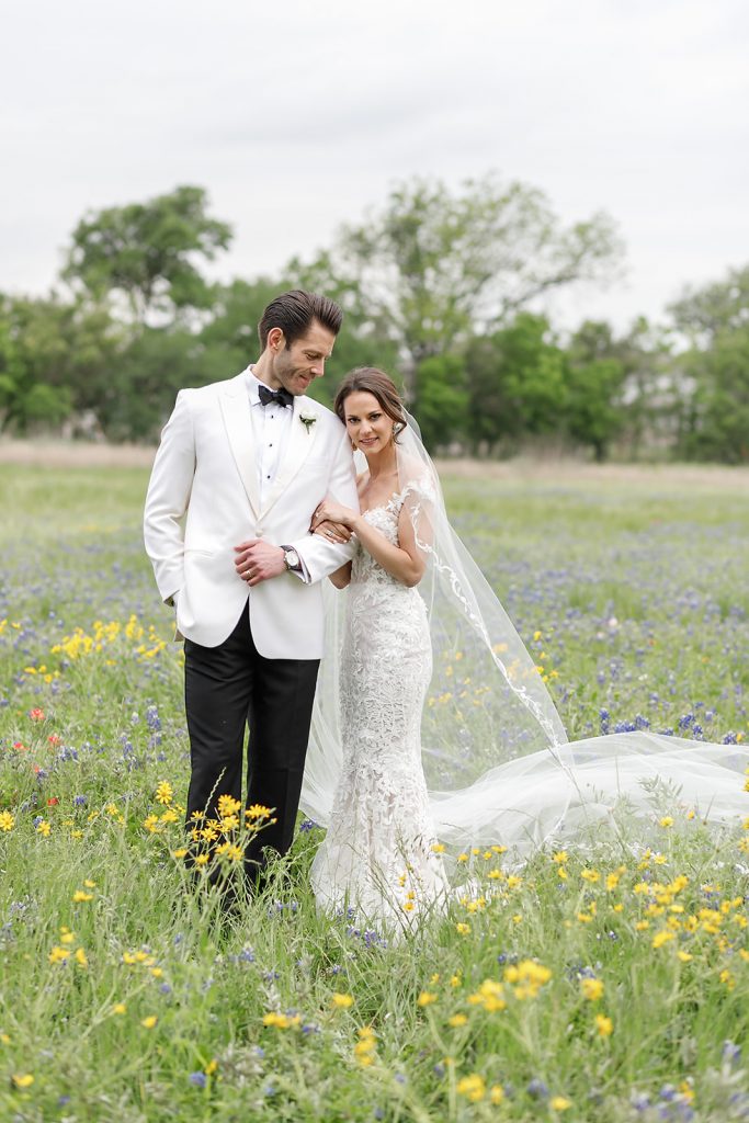 bride and groom portraits in a field of wildflowers