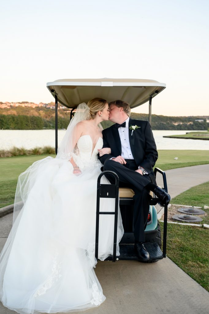 Couple on the back of the golf cart at their Austin Country Club wedding