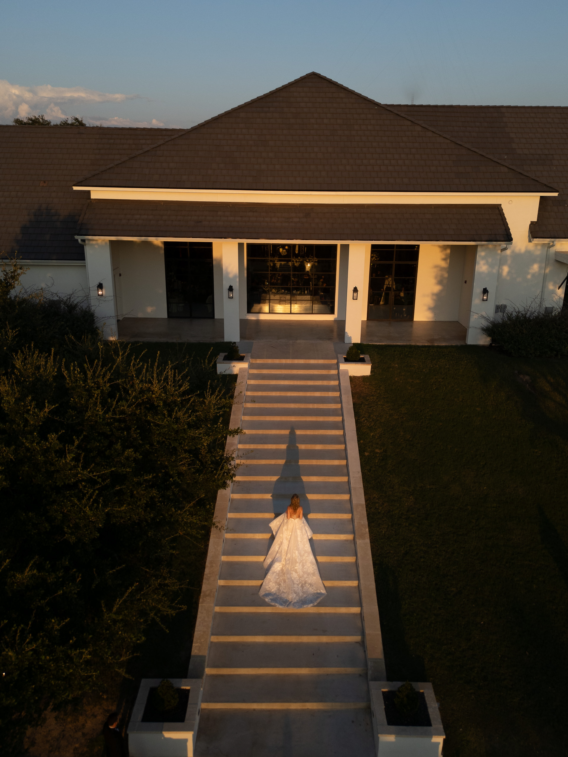 Drone arial photo of bride walking up the steps at the Arlo at sunset creating a dramatic fashion forward image