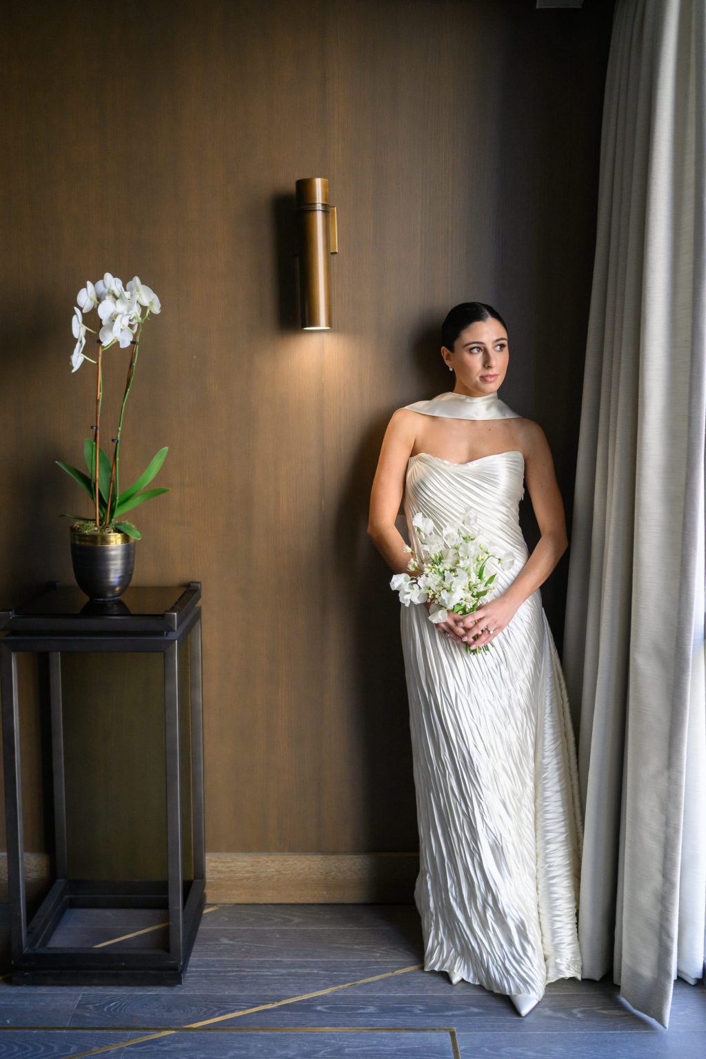 Bride holding a white bouquet during an indoor bridal portrait at Four Seasons Austin