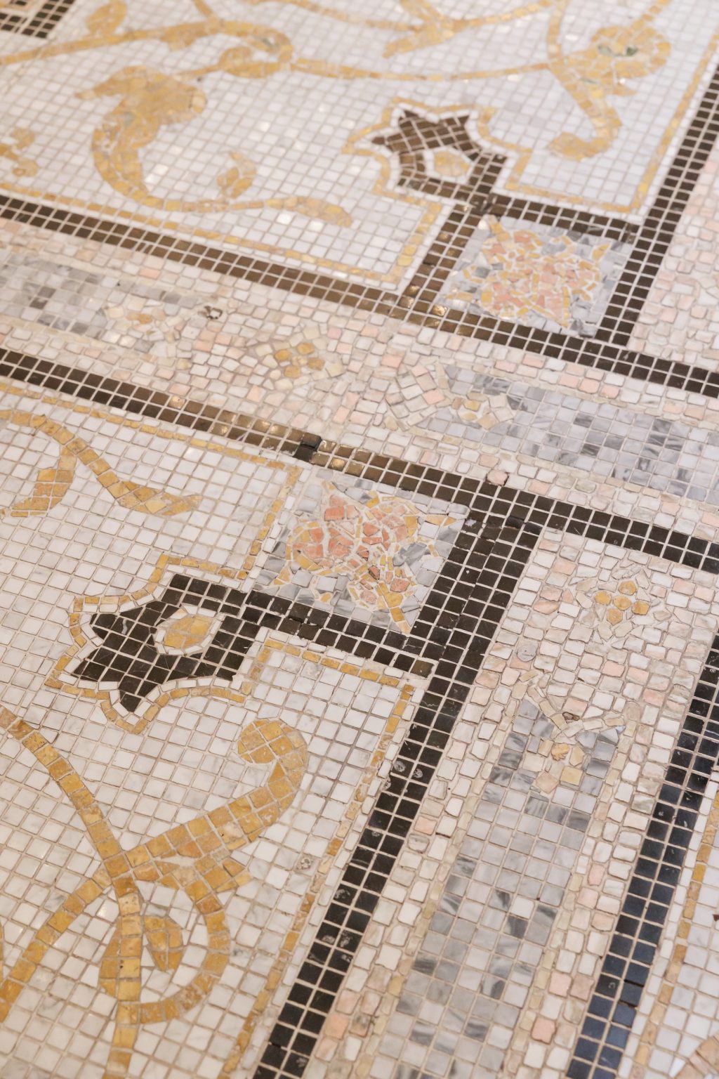 Decorative tile floor and architectural detail inside Le Tesserae in Houston.