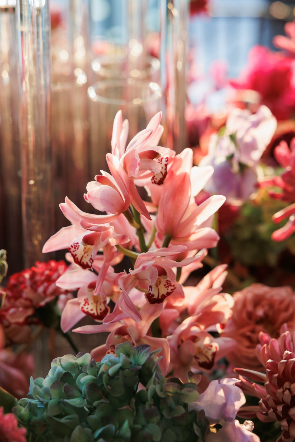 Close view of pink floral arrangements used throughout reception design.