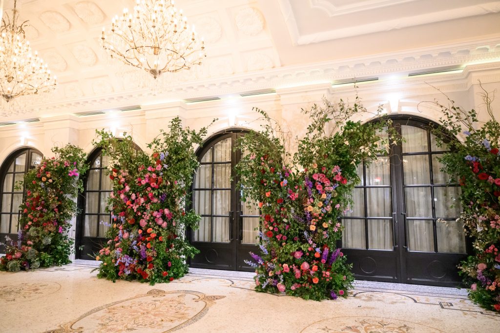 Floral lined exterior of Le Tesserae during Bailey and Alton’s Houston wedding reception.