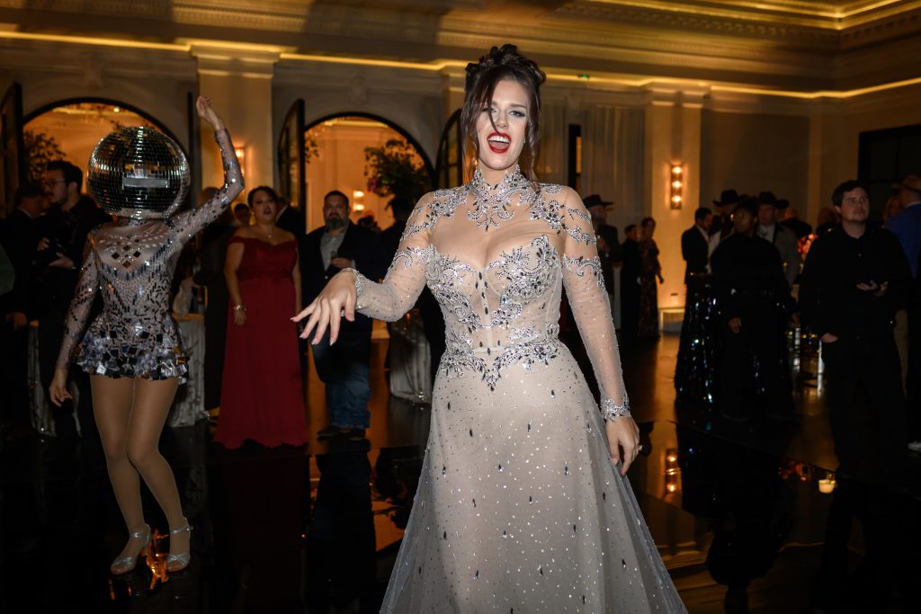 Bailey smiling on the dance floor during her wedding reception at Le Tesserae.