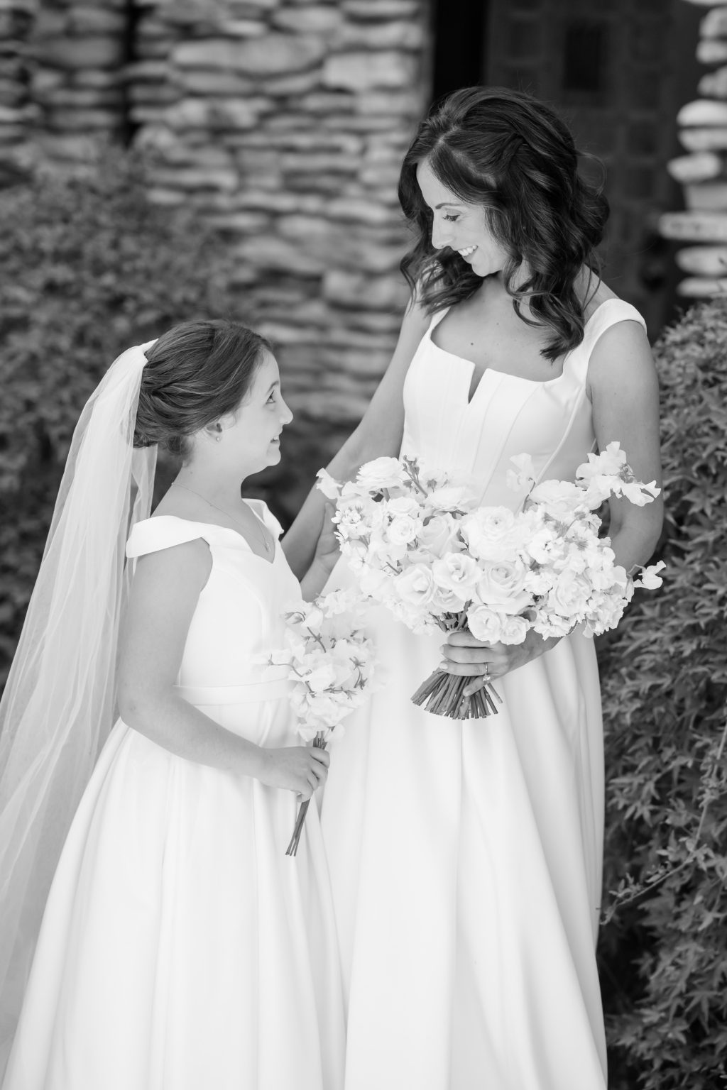 Bride and daughter sharing a quiet moment before the ceremony.