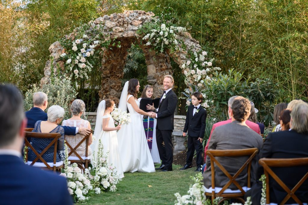 Couple standing with their children during their wedding ceremony