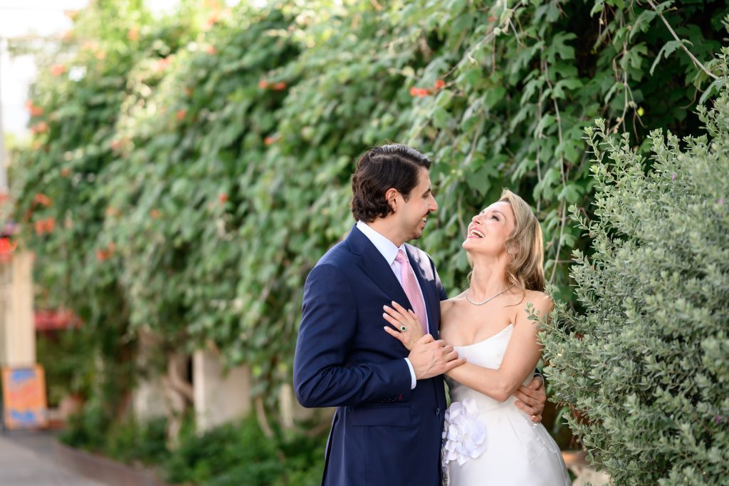 Bride and groom laughing together during Austin wedding weekend portraits
