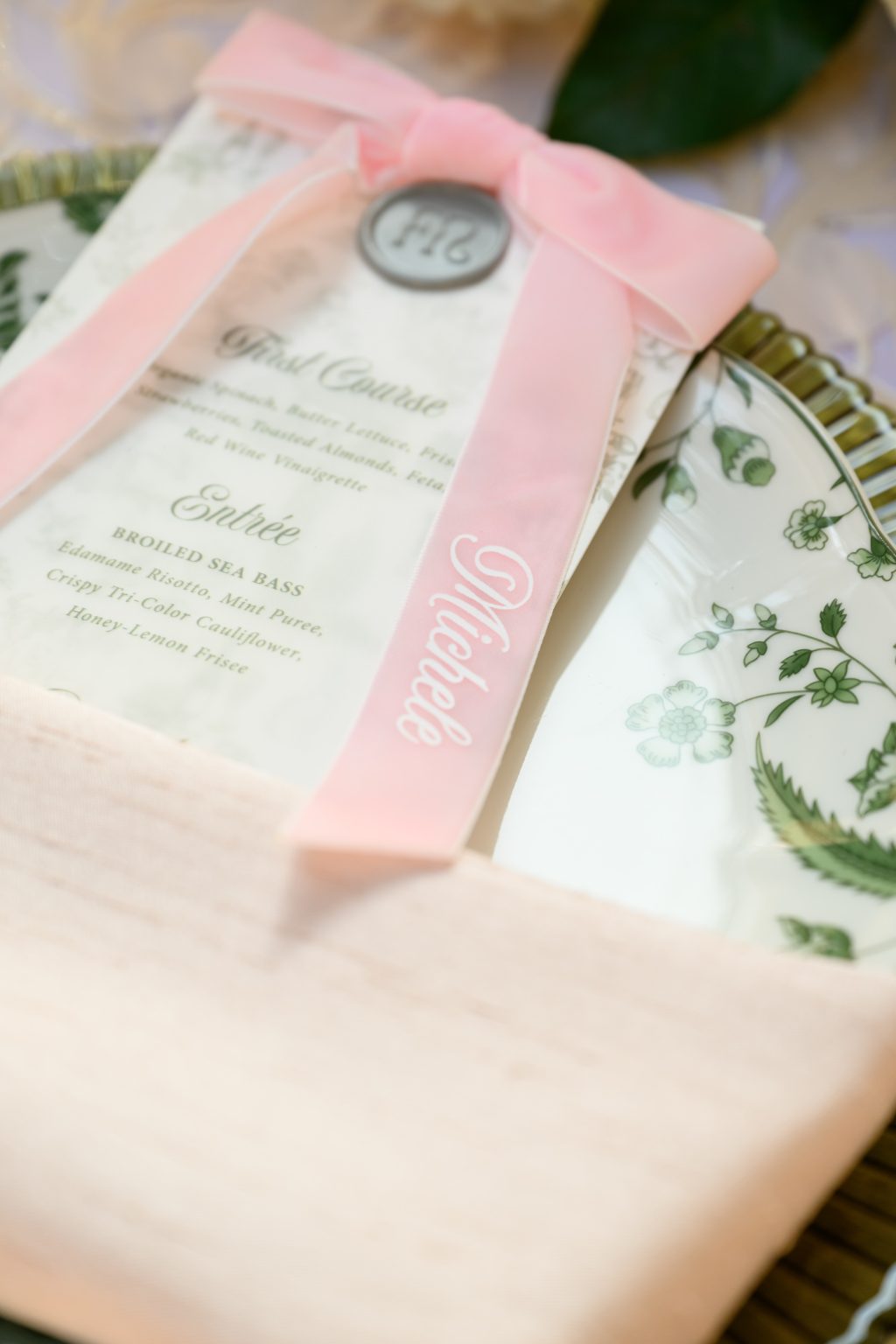 Personalized wedding menu with embroidered pink bow place card