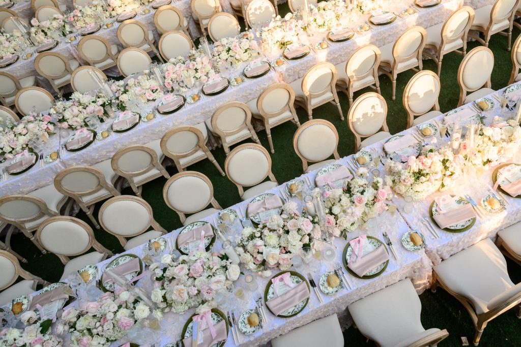 Long outdoor reception table with pink and white flowers at Four Seasons Austin