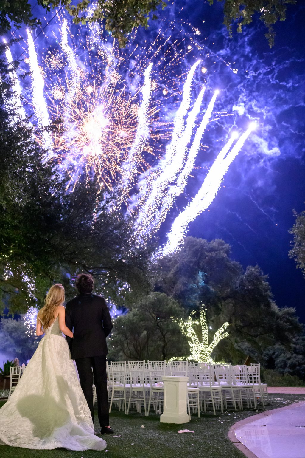 Bride and groom watching fireworks during their Four Seasons Austin wedding