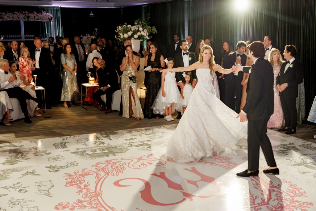 Bride and groom dancing on a custom wedding dance floor at Four Seasons Austin