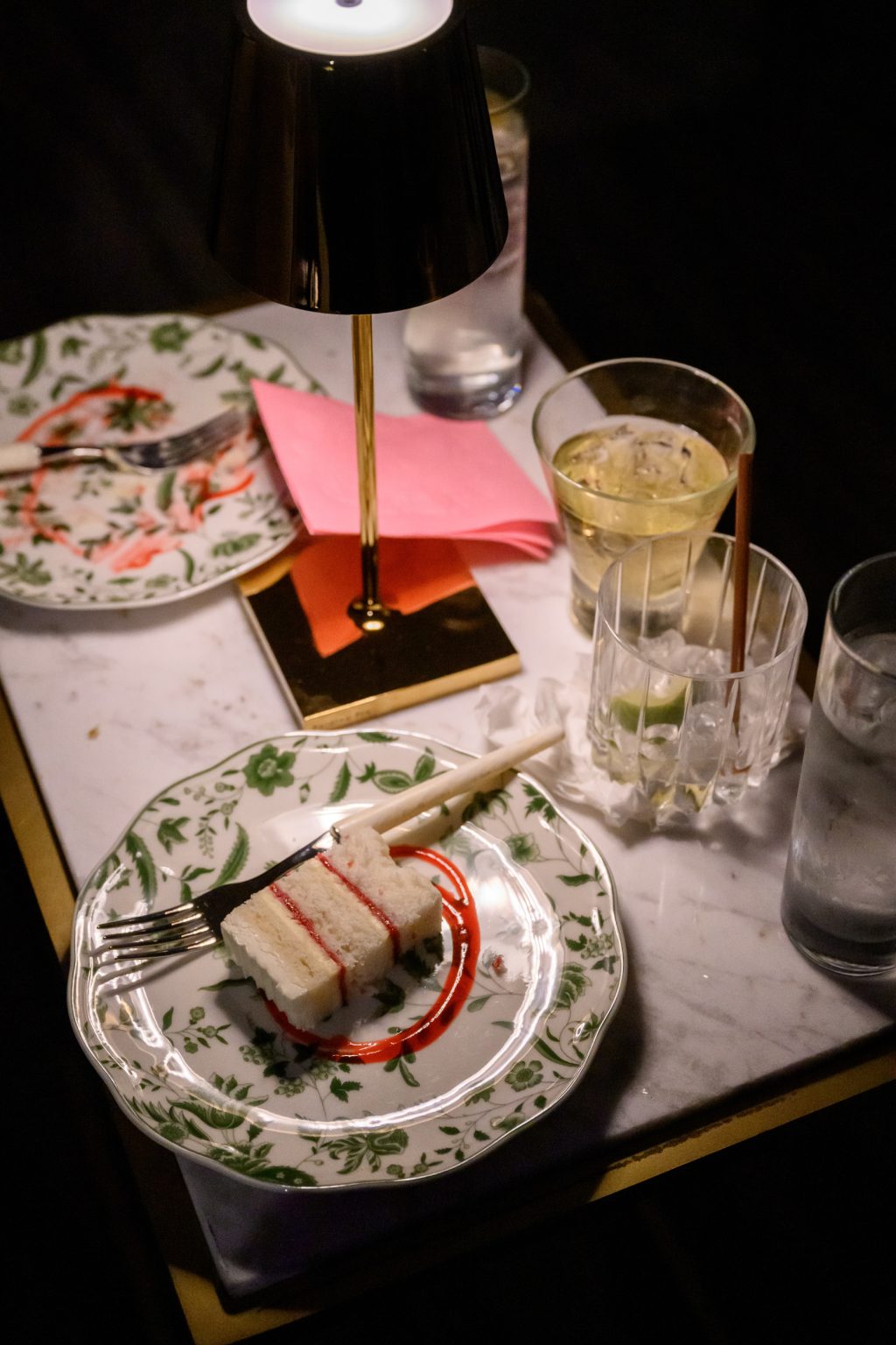 Late night detail of the cake served showing the party vibe of the reception
