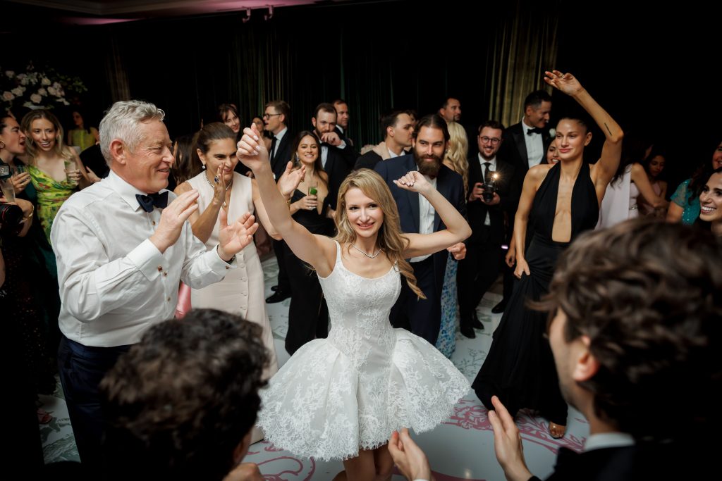 Candid wedding reception moment surrounded by cheering guests in Scoop Neck Lace Mini Wedding Dress with Bubble Skirt, LAXAG