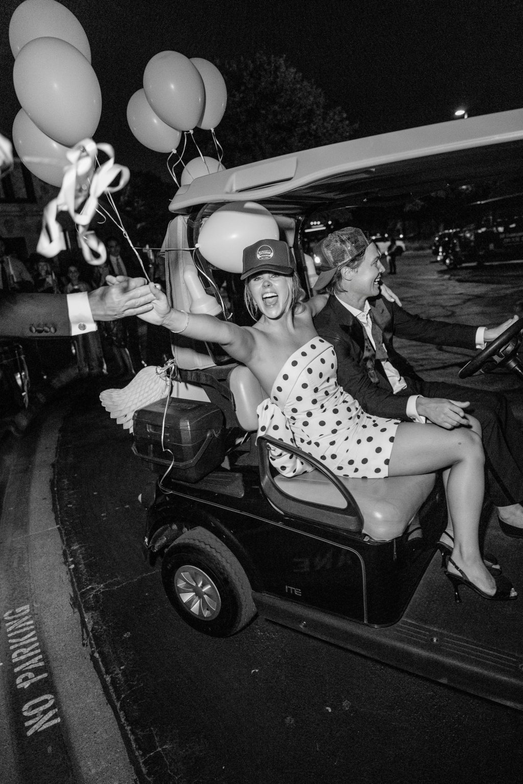 Bride and Groom laughing during a golf cart exit at a Dallas wedding