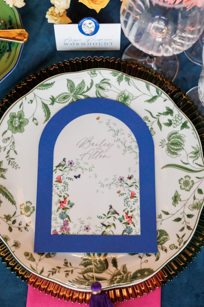 close up of the dinner plate with a custom menu card on top