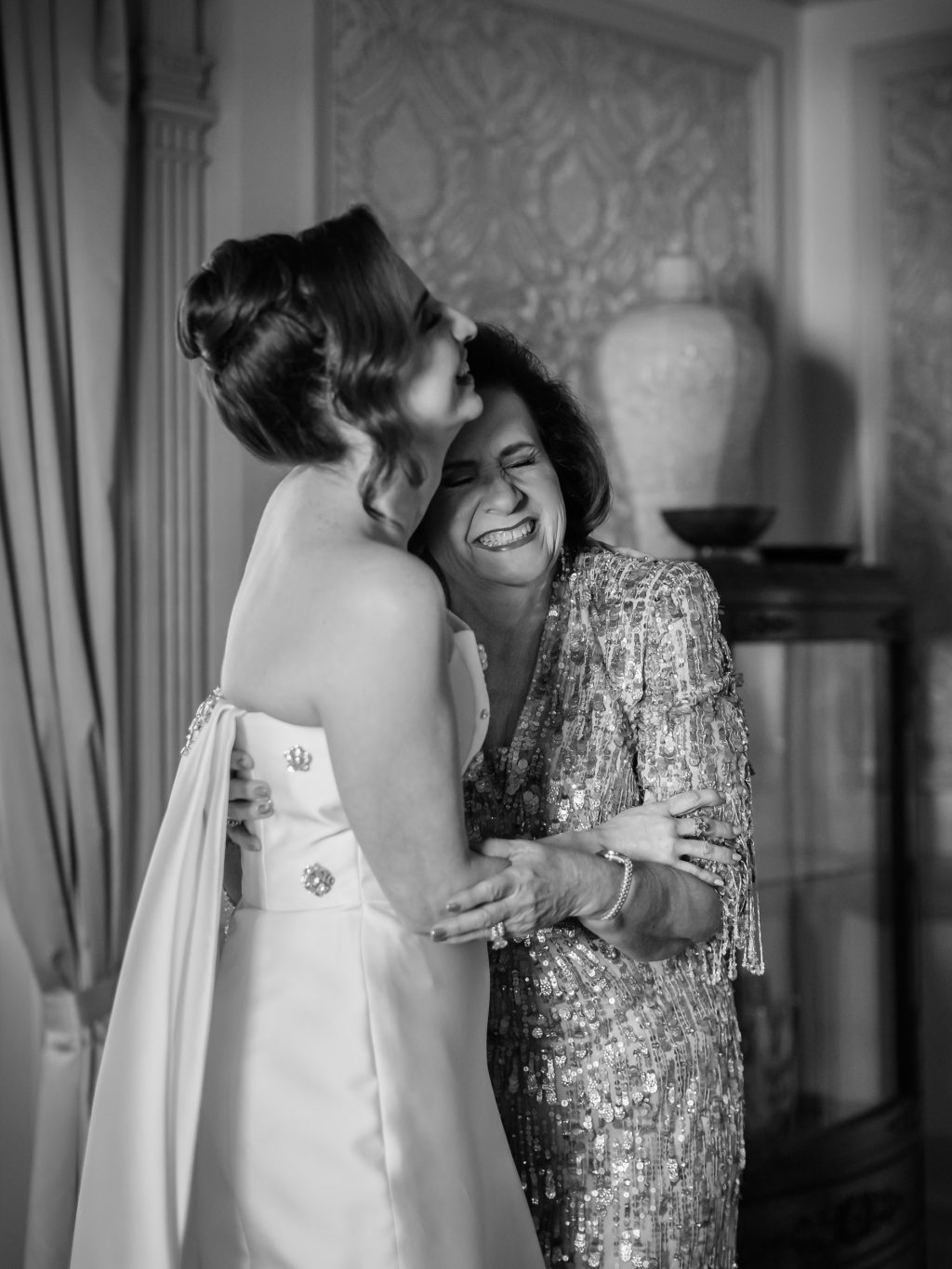 Bride hugging her mother before her New Year’s Eve wedding at The St. Anthony Hotel