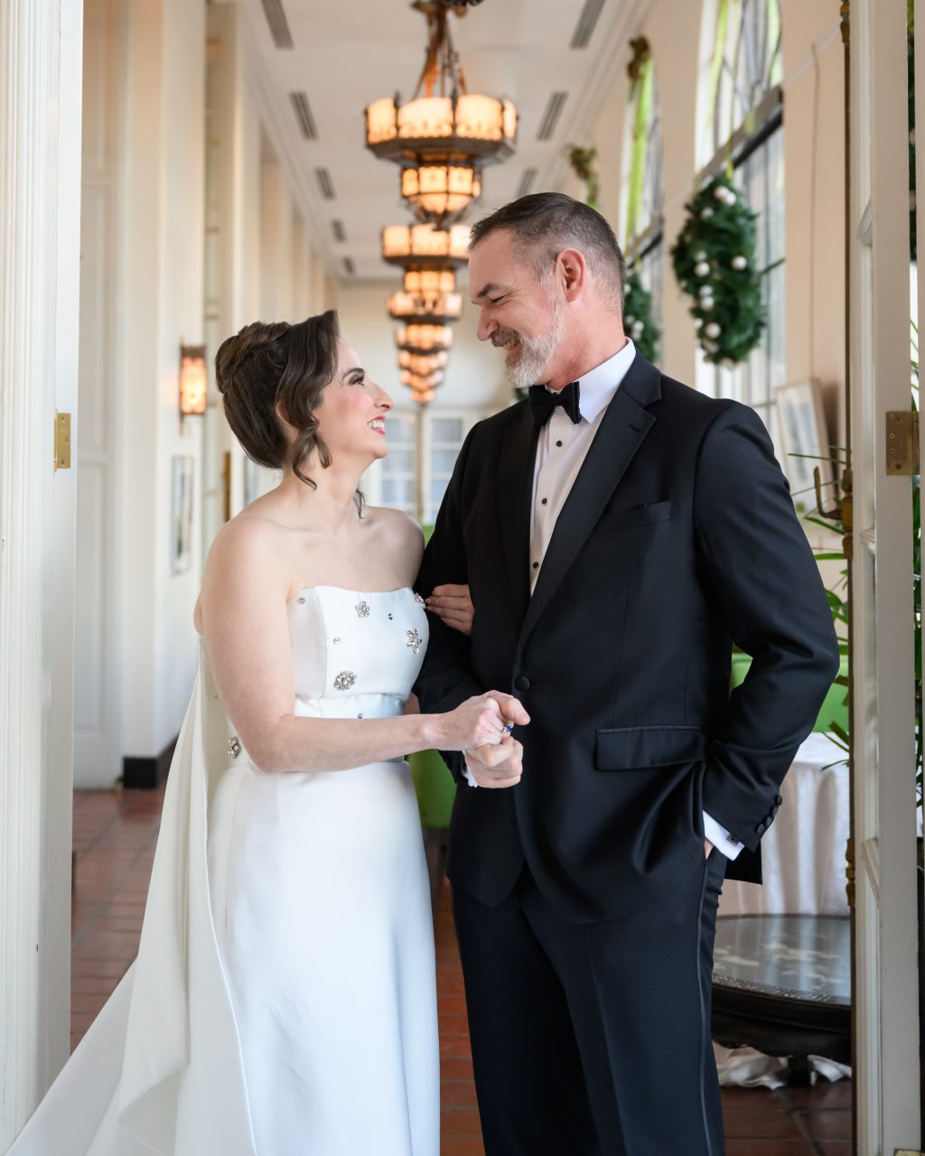 Bride and groom smiling together during portraits at The St. Anthony Hotel