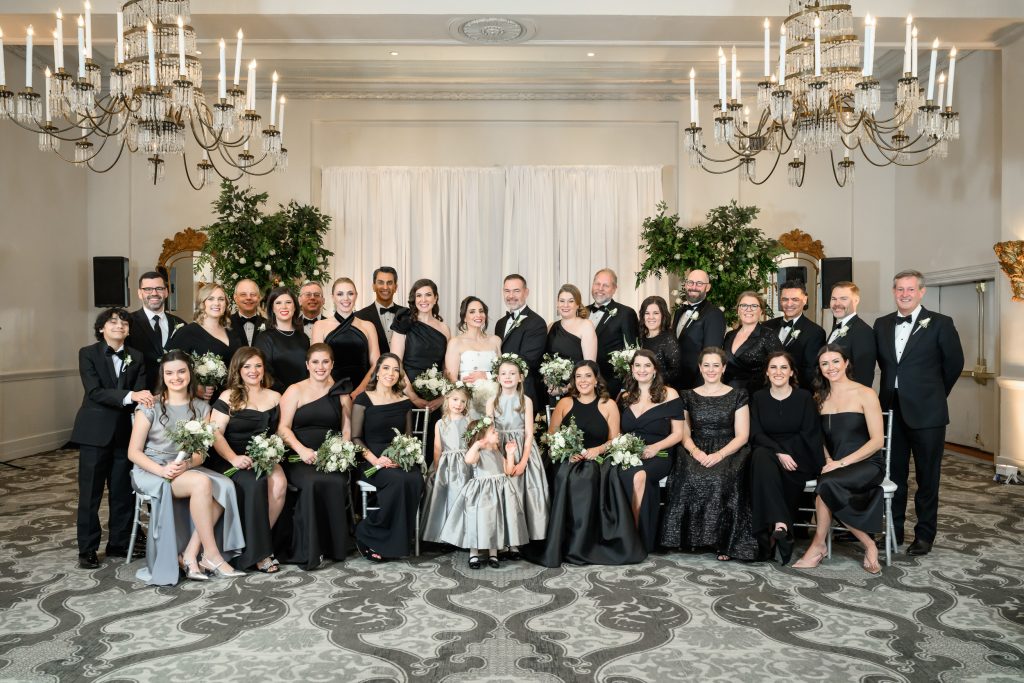 Large family wedding party portrait inside The St. Anthony Hotel in San Antonio