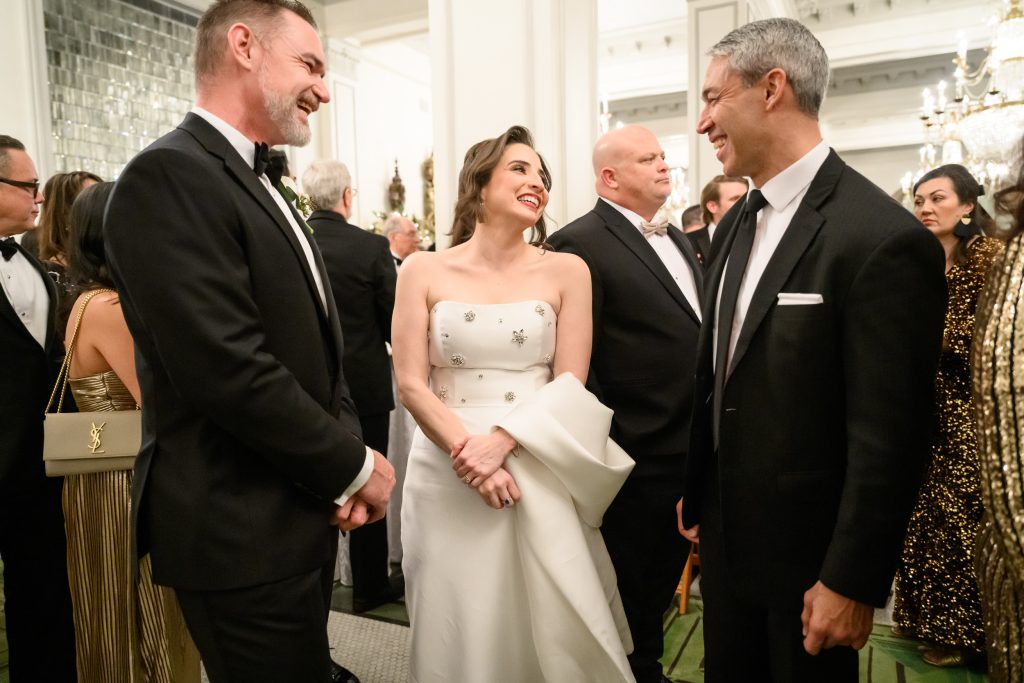 Bride and groom greeting guests during their New Year’s Eve wedding reception with the Mayor as a wedding guest