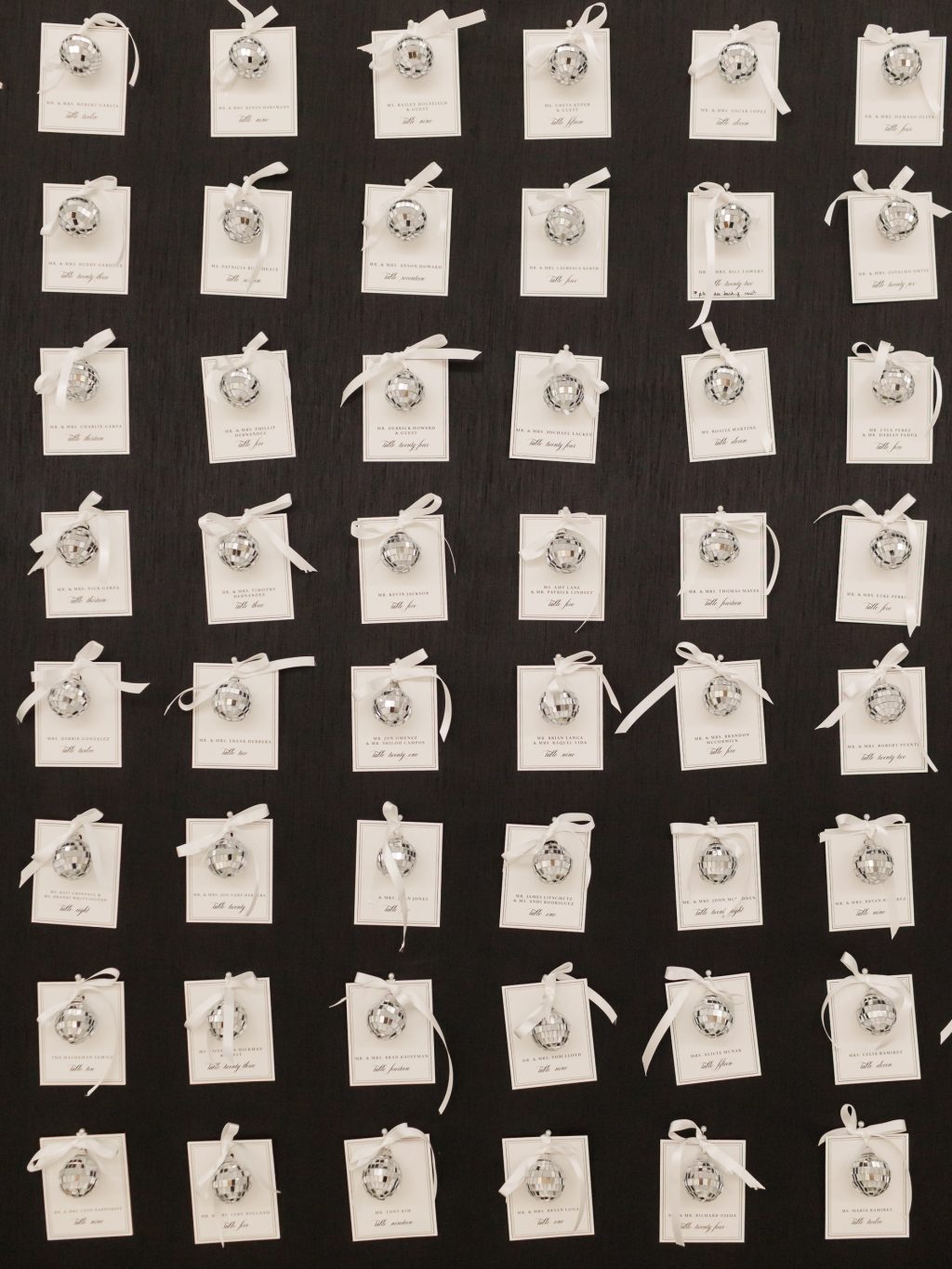 Black and white escort card display at a New Year’s Eve wedding planned by Wilkinson Rhodes