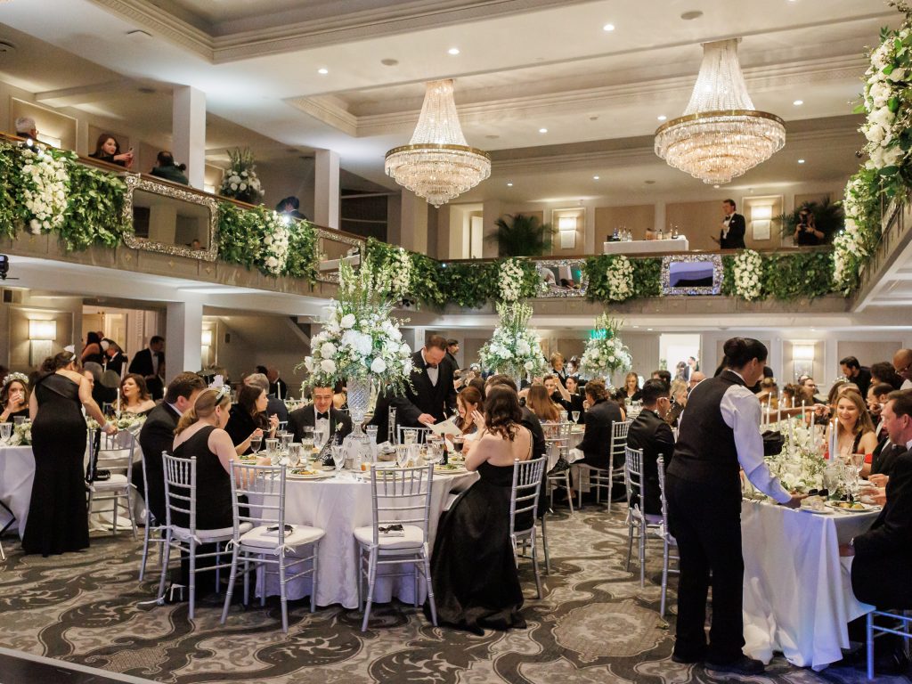 Guests seated for dinner during the New Year’s Eve wedding reception