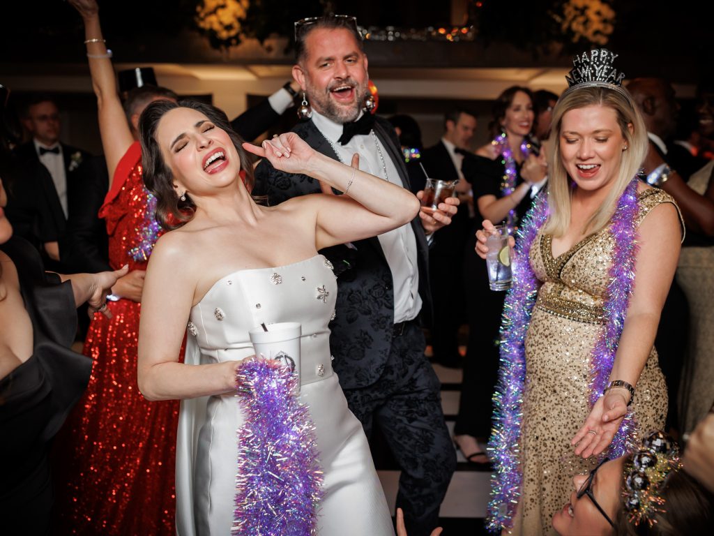 Bride dancing with guests during the New Year’s Eve wedding celebration