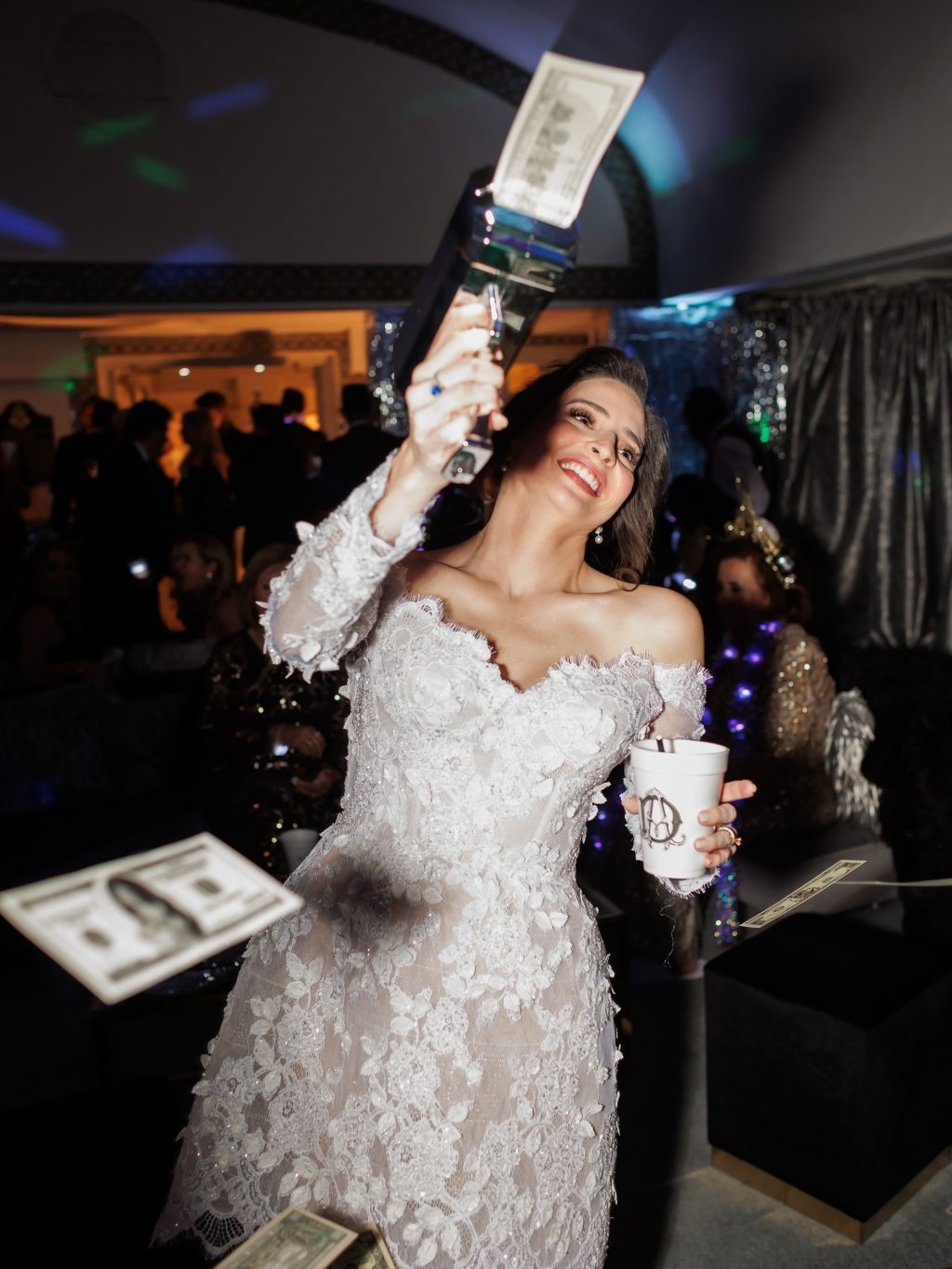 Bride celebrating during the late night wedding after party at The St. Anthony Hotel