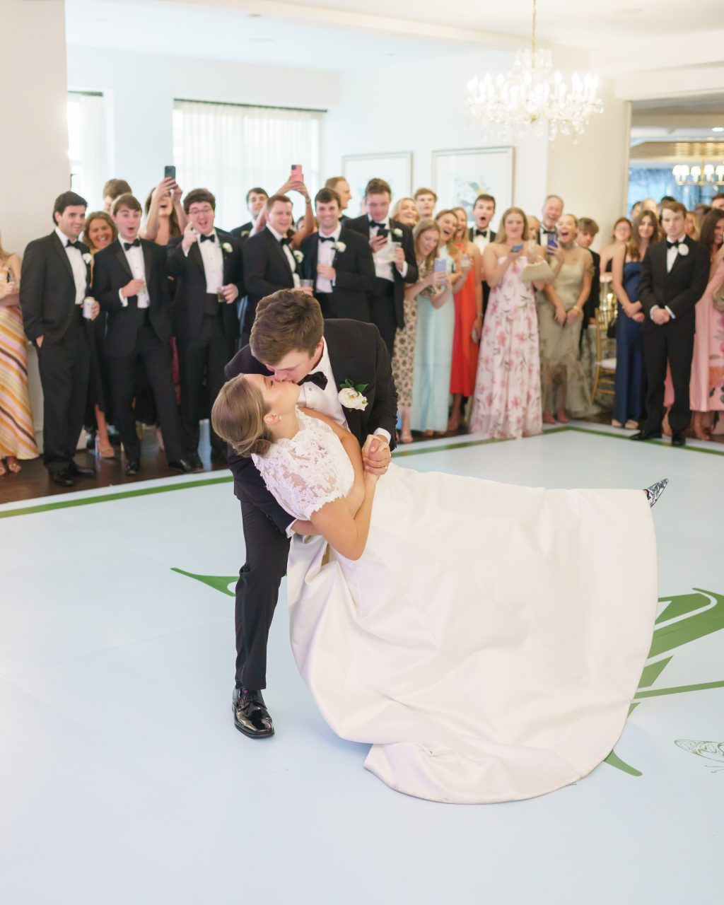 Maddy and Will share their first dance surrounded by guests at Westwood Country Club