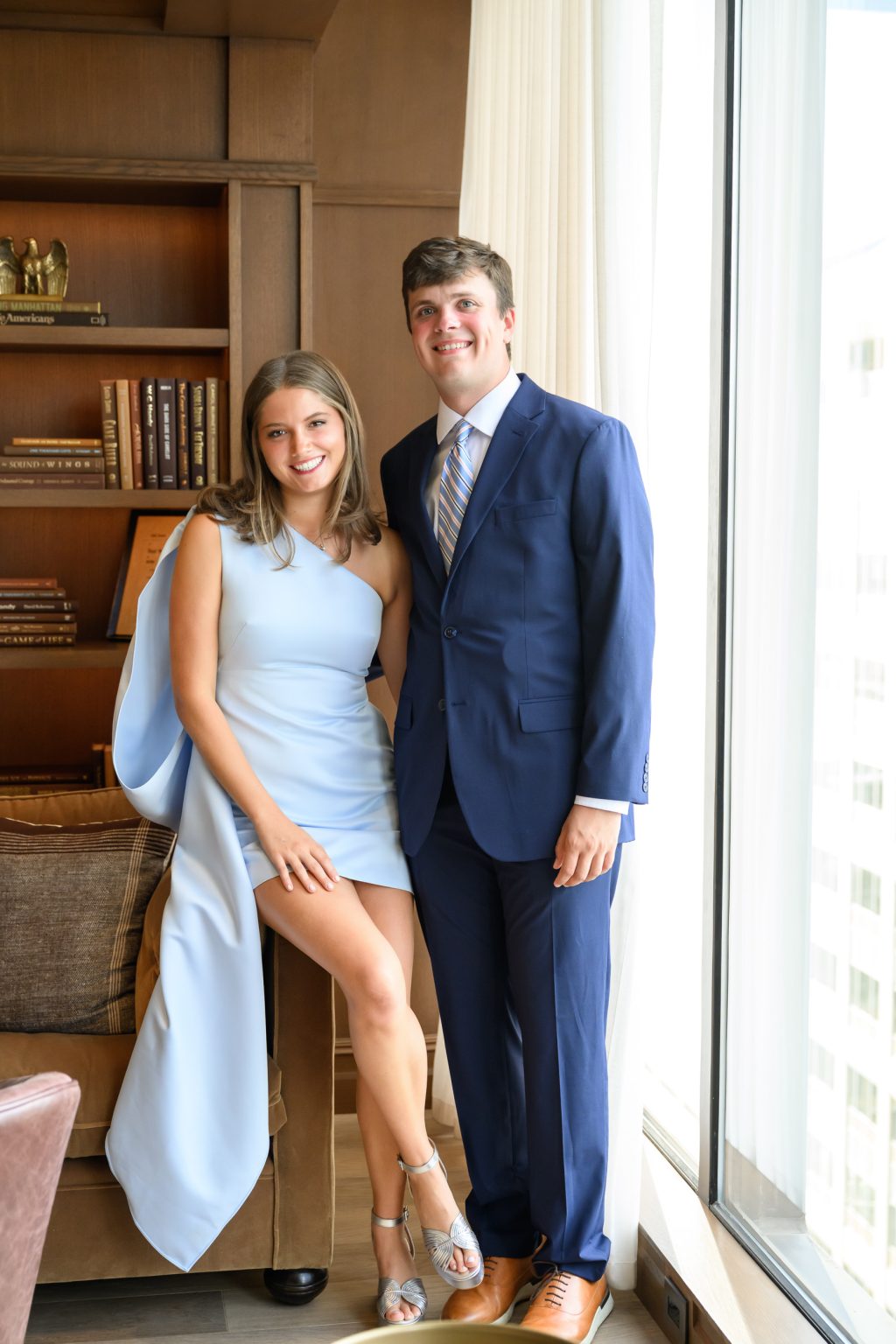 Maddy and Will dressed in blue for their Headliners Club rehearsal dinner