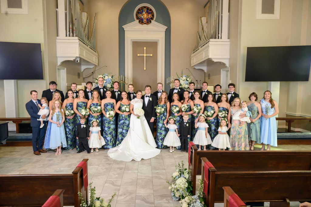 Full wedding party portrait inside Tarrytown United Methodist Church