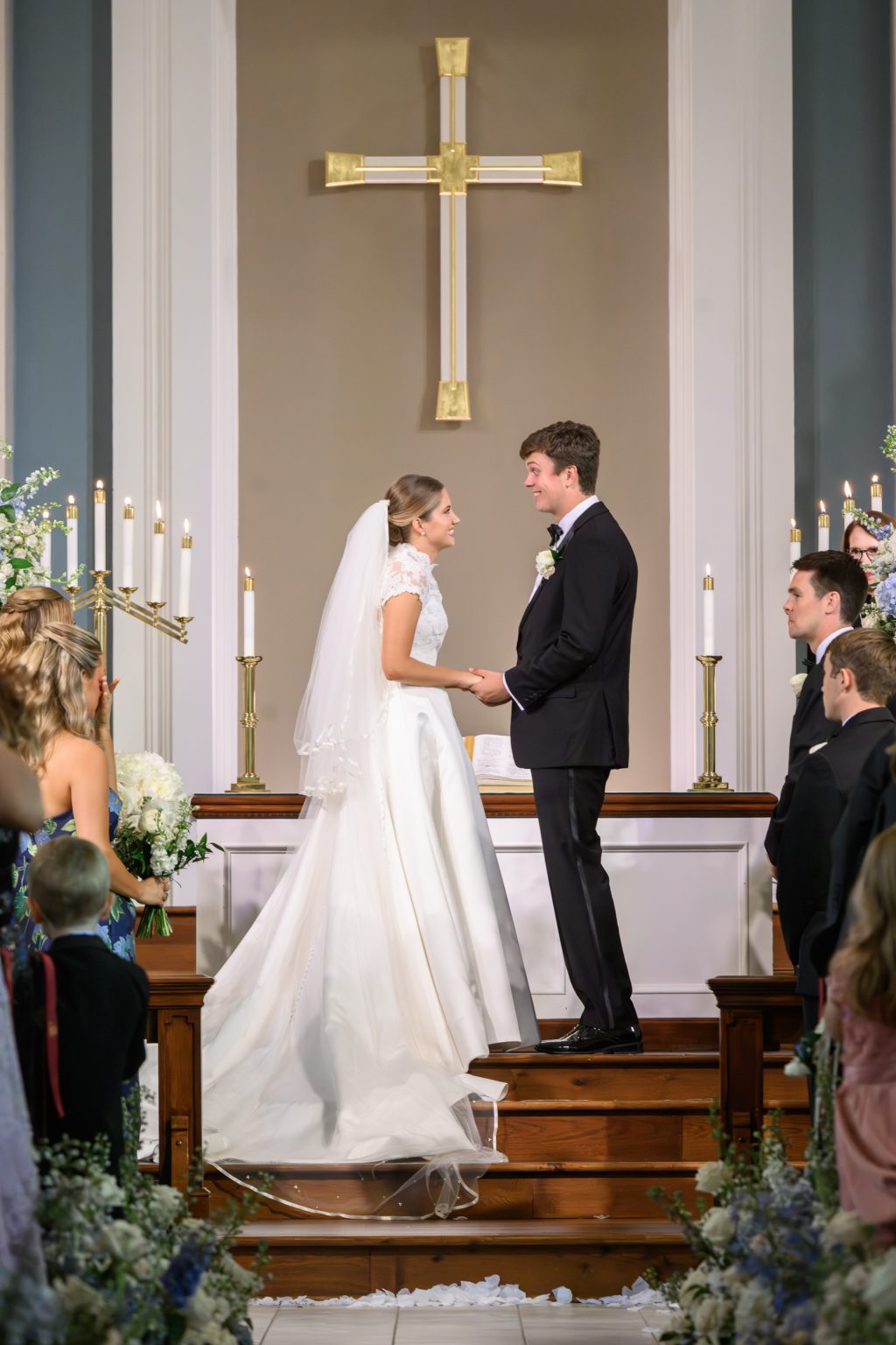 Maddy and Will exchange vows at the altar of Tarrytown United Methodist Church