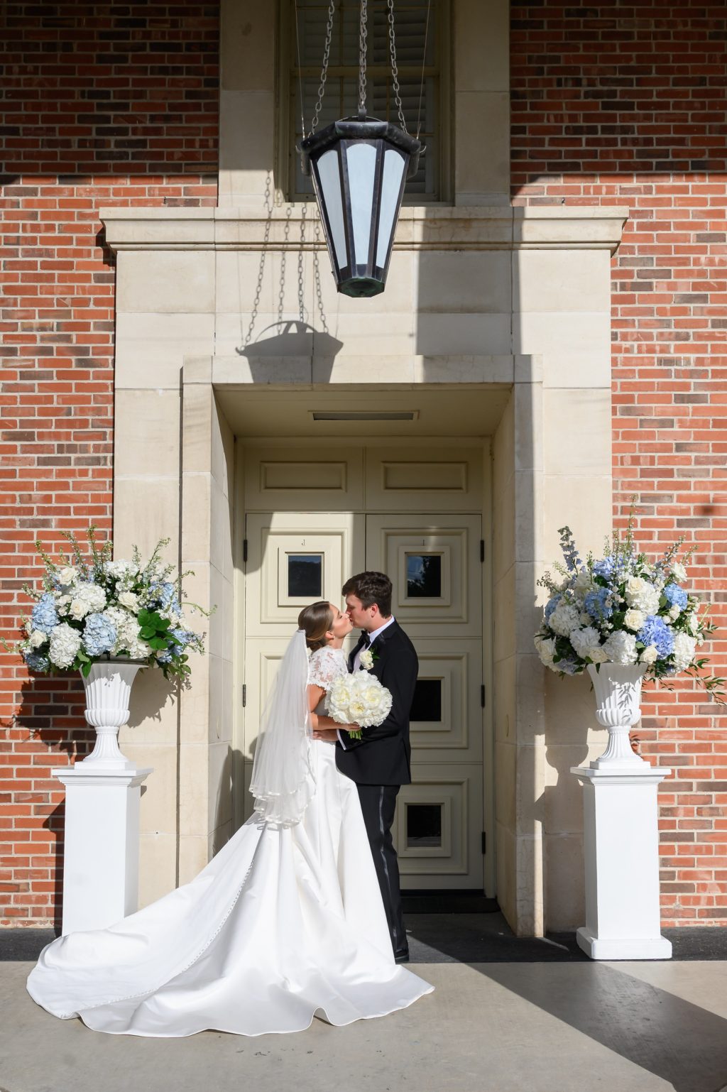 Bride poses beneath the portico of Tarrytown United Methodist Church