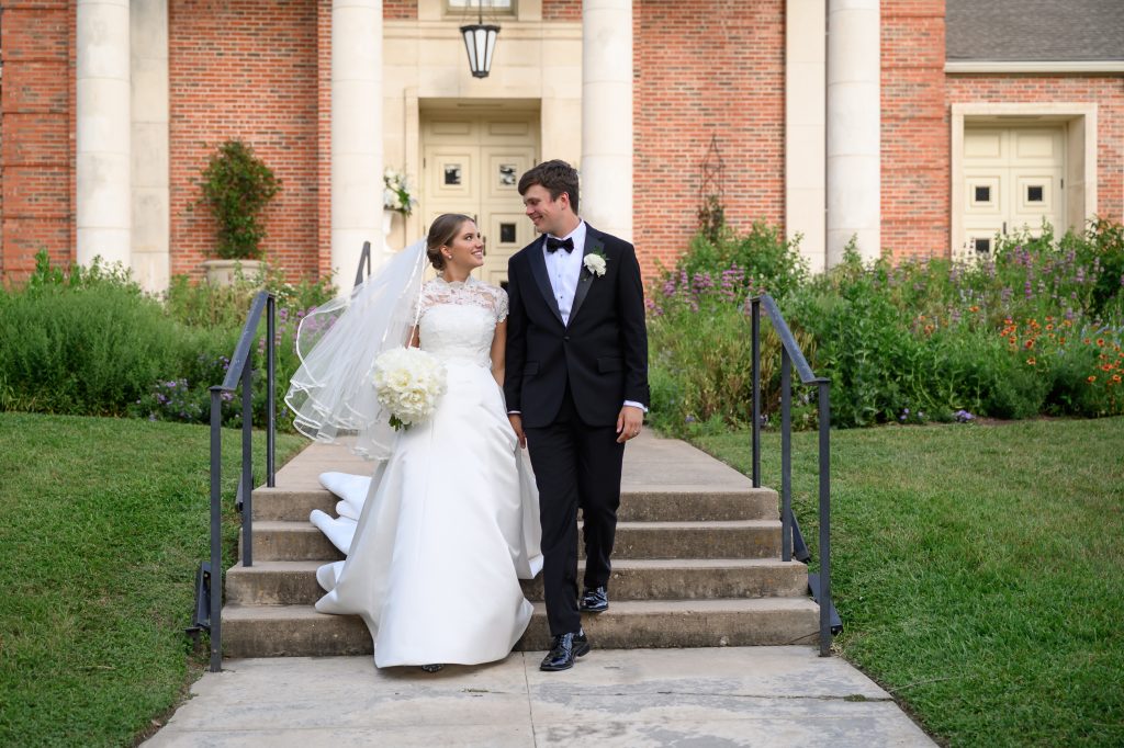 Maddy and Will walk down the steps of Tarrytown United Methodist Church