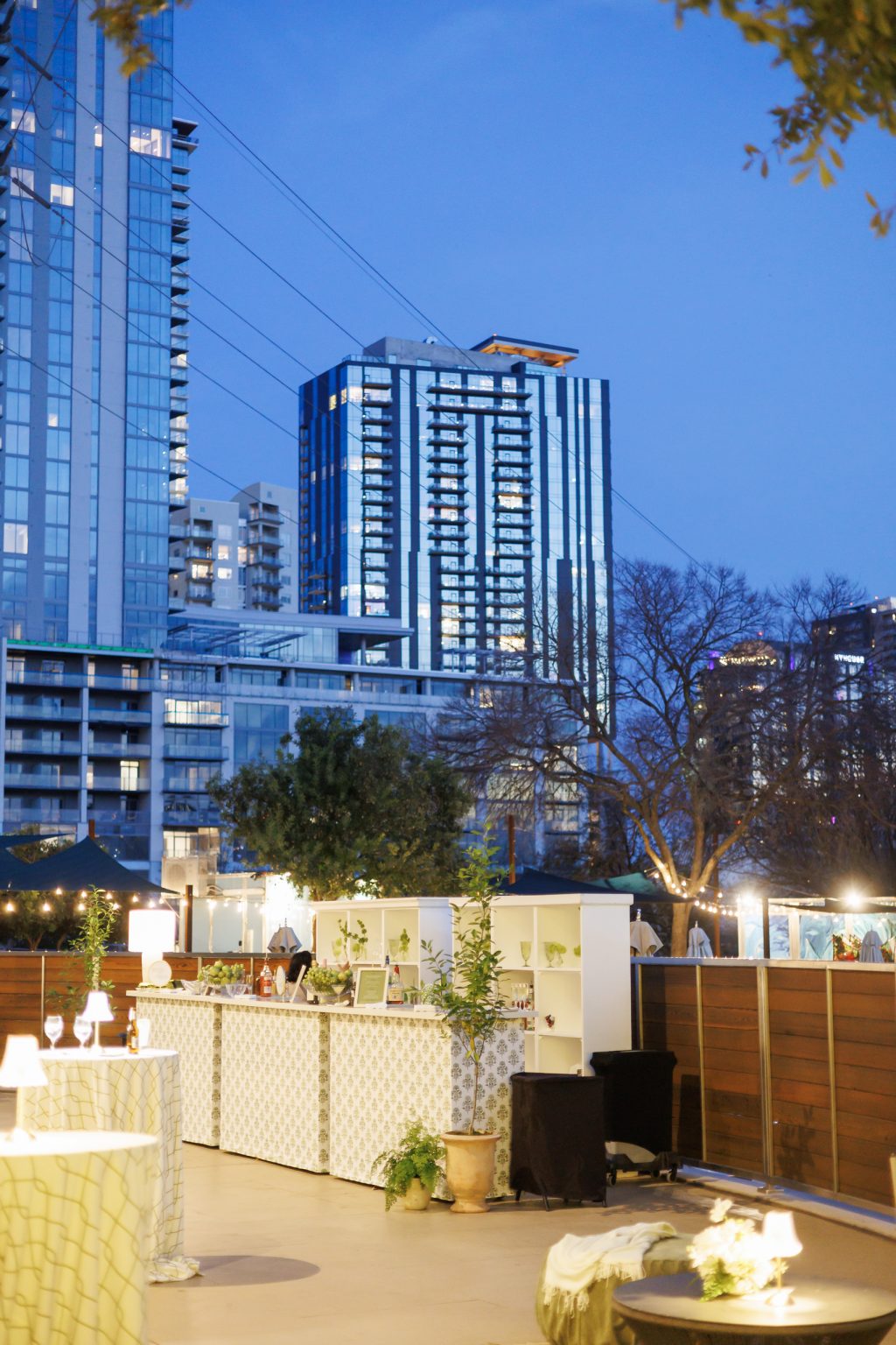 Night photo of the four seasons terrace with the Austin skyline in the back